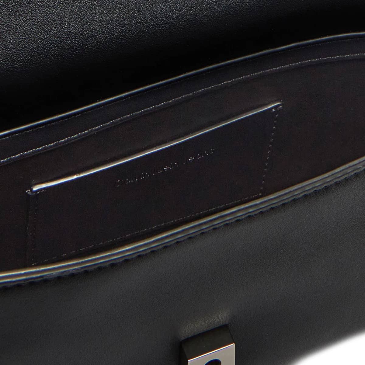 Calvin Klein Jeans Black Bag with Embossed Logo and Sleek Hardware